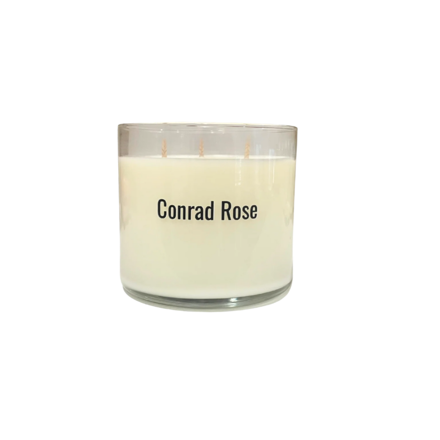 Candle with 'Conrad Rose' branding on a white background