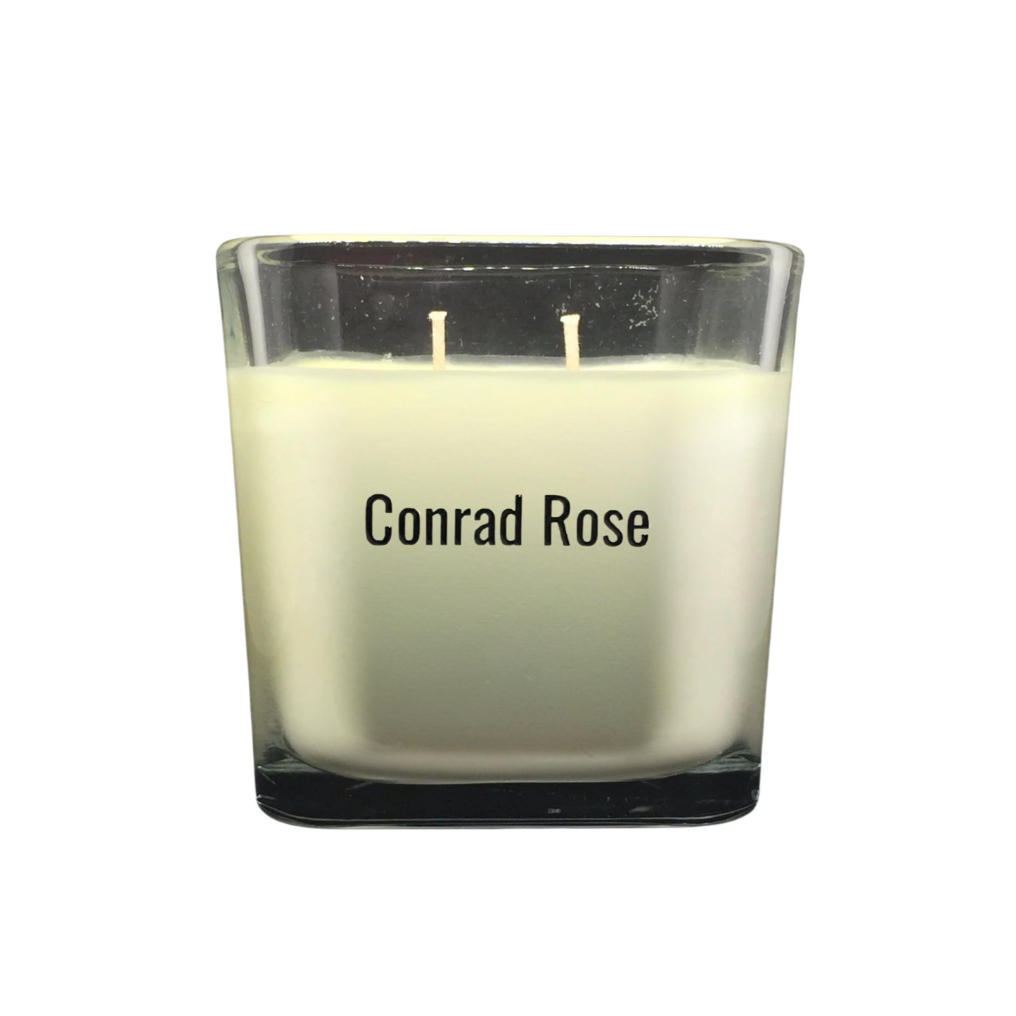 Candle with 'Conrad Rose' branding on a white background